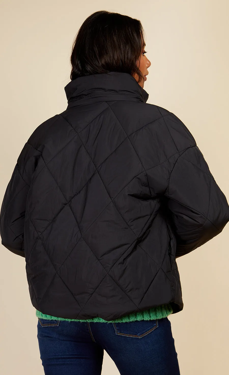 Black Quilted Puffer Jacket by Vogue Williams